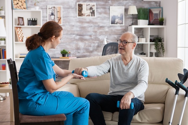 Nurse caring for patient at home